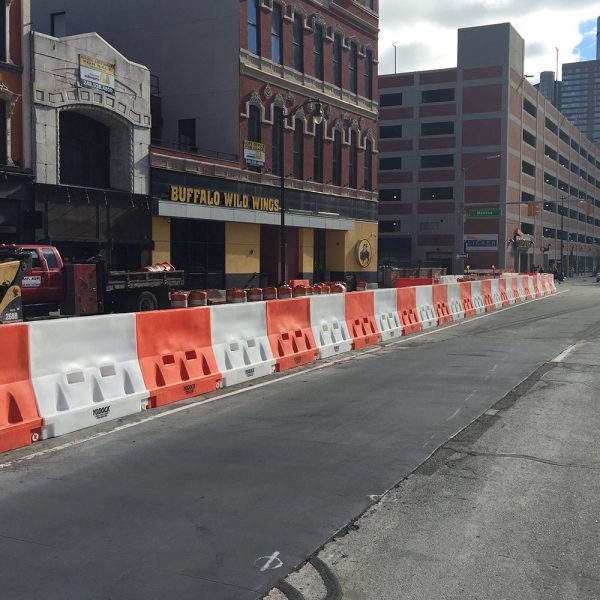 Yodock safety barrier placed around work site area to separate street traffic from construction work